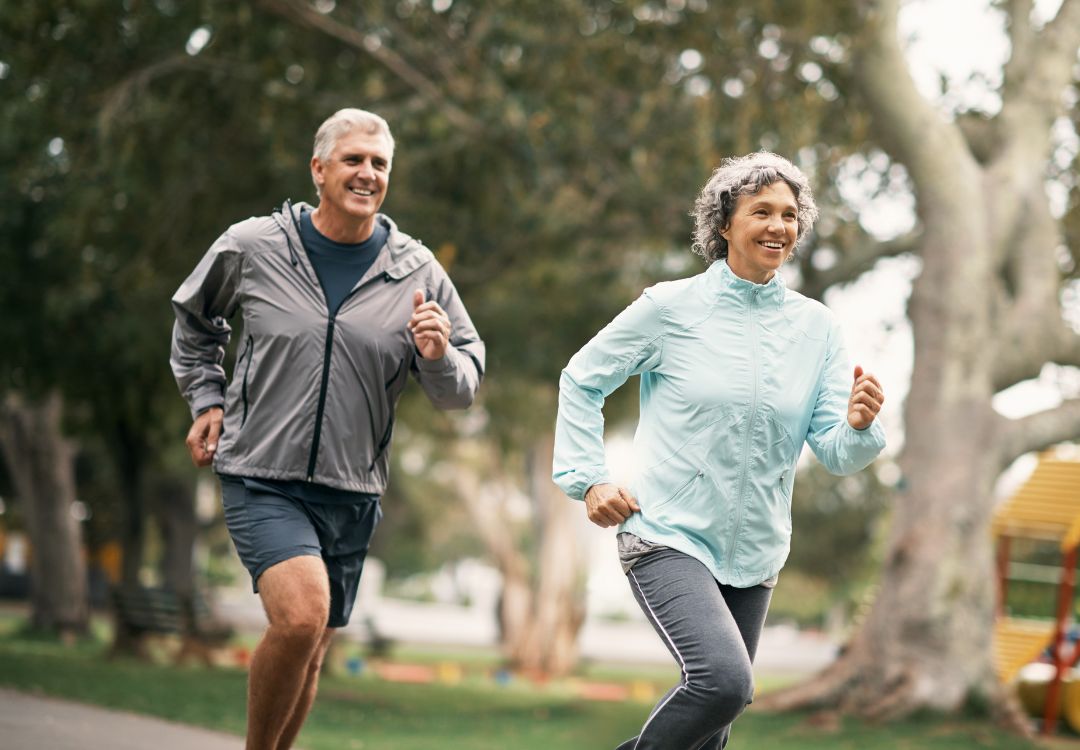 Active couple jogging outdoors — energy and longevity