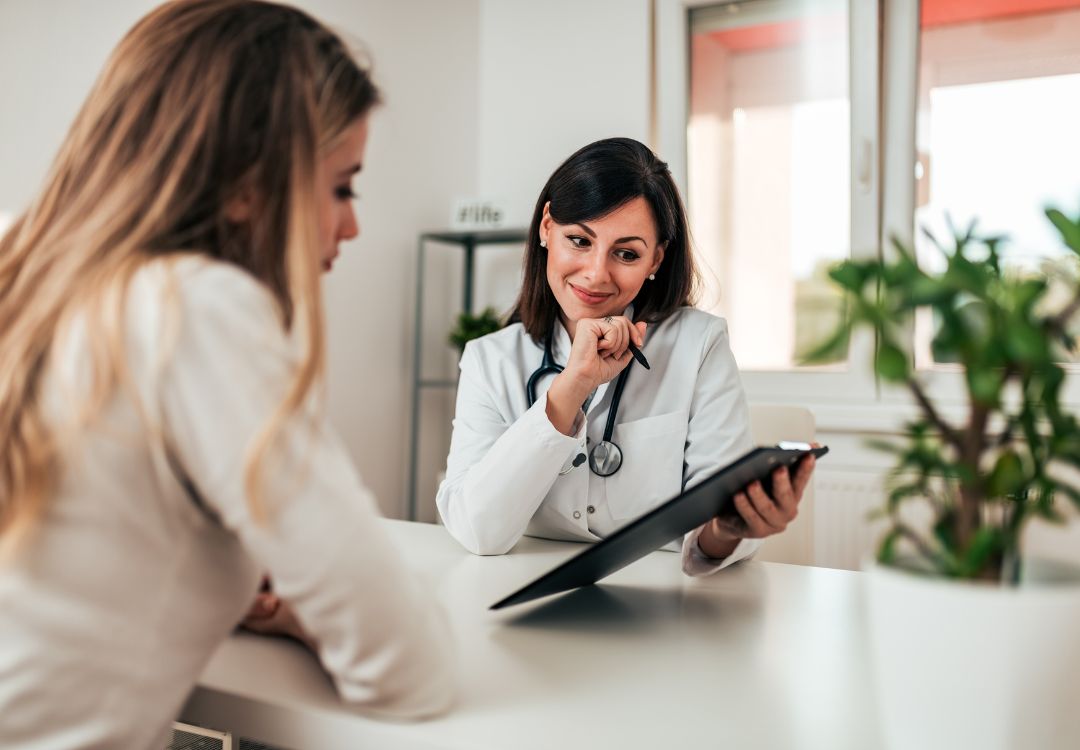Provider walking a patient through her wellness plan