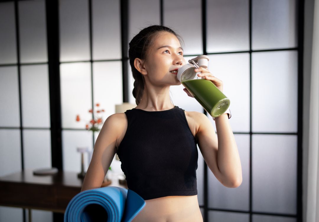 Woman enjoying a healthy smoothie after a workout